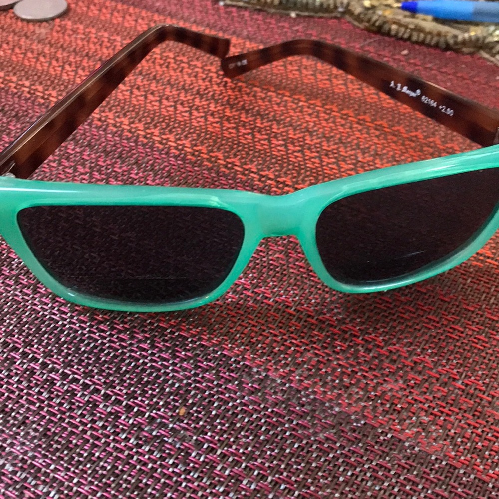 Bifocal sunglasses ( cheaters) so you can read in the sun